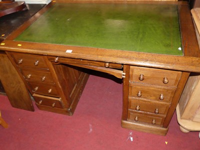 Lot 1229 - An early 20th century oak and green leather...