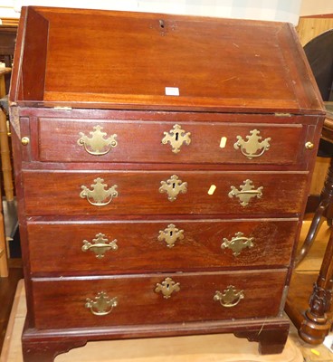 Lot 1231 - A 19th century mahogany slopefront writing...