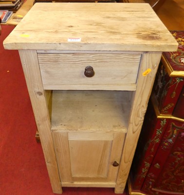 Lot 1237 - A rustic pine single door bedside cupboard...