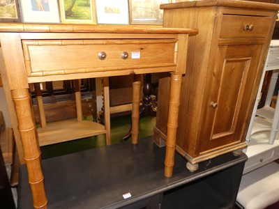Lot 1243 - A pine single drawer side table, raised on...