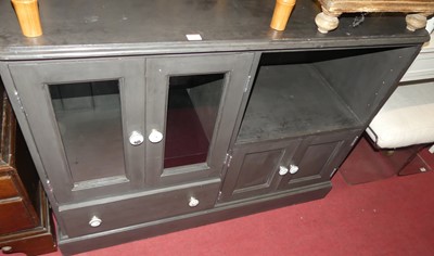 Lot 1244 - A contemporary black painted pine low side...