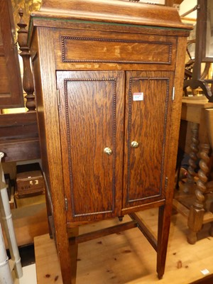 Lot 1247 - A 1930s oak freestanding gramophone cabinet...