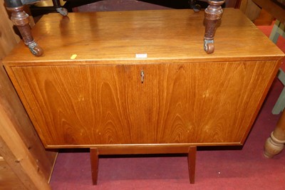 Lot 1252 - A 1960s teak single Ladderax fall-front unit,...
