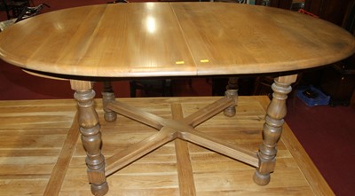 Lot 1275 - A contemporary Ercol mid elm D-end extending...