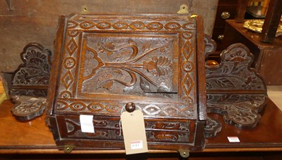 Lot 1312 - An early 20th century floral relief carved oak...