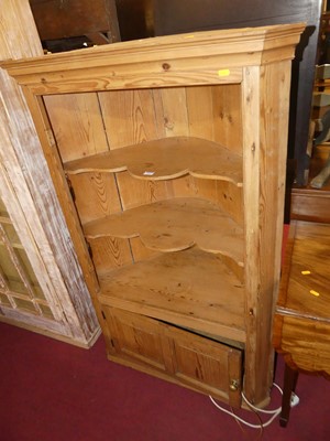 Lot 1323 - A rustic pine low freestanding corner cupboard,...