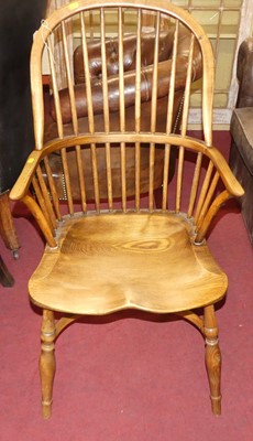 Lot 1343 - A contemporary elm Windsor chair, having a...