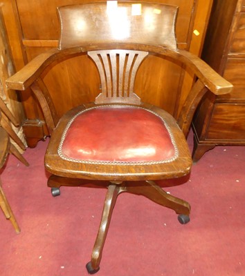 Lot 1348 - A 1930s oak slatted fan and barback tub swivel...