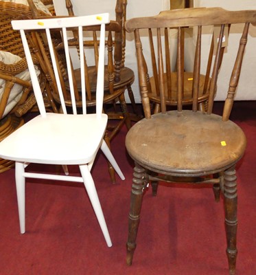 Lot 1351 - A set of four early 20th century elm seat and...