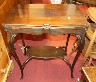Lot 1375 - An Edwardian mahogany shaped top fold-over...