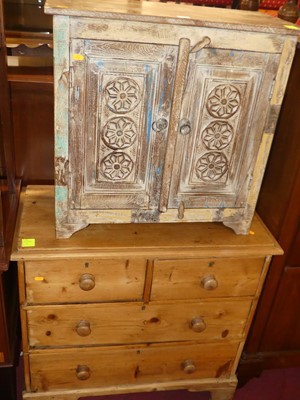 Lot 1377 - A rustic stained pine low chest of two short...