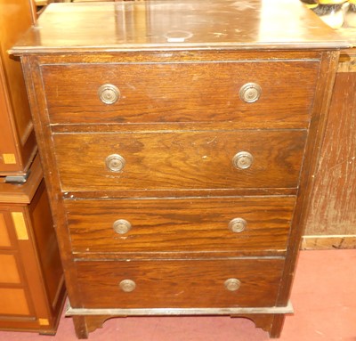 Lot 1382 - A 1930s oak chest of four long drawers, w.75cm
