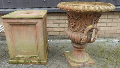 Lot 1401 - A large terracotta twin handled pedestal...