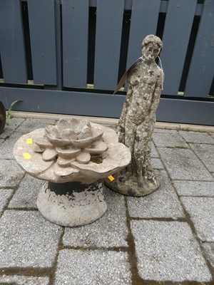 Lot 1412 - A small reconstituted stone garden figural...