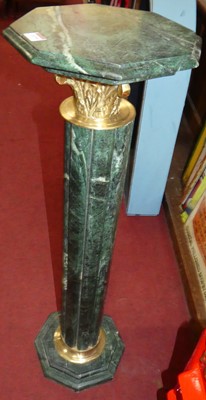 Lot 1139 - A pair of contemporary verdigris marble...