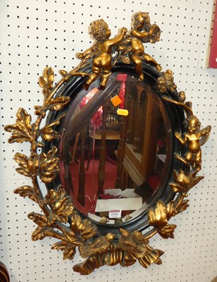 Lot 1151 - A contemporary moulded composite and gilt...