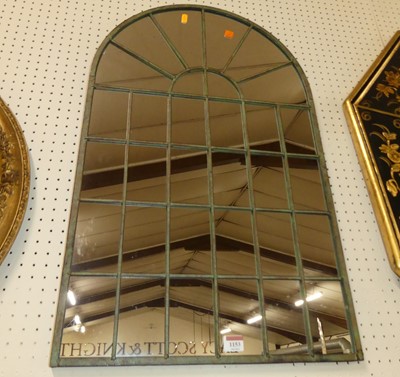 Lot 1153 - A contemporary metal framed arched wall mirror,...