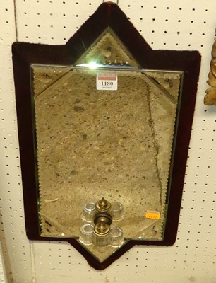 Lot 1180 - An early 20th century velvet clad wall mirror,...