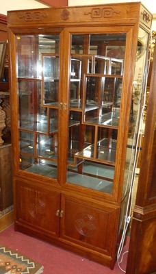Lot 1186 - A Chinese contemporary hardwood double door...
