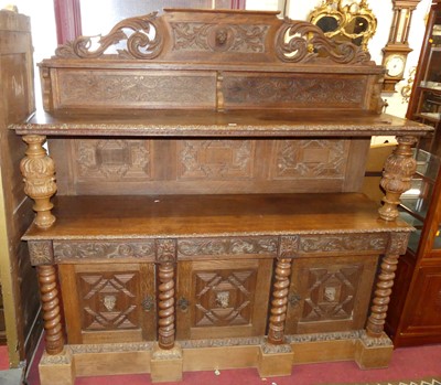 Lot 1189 - A circa 1900 Flemish relief carved oak buffet...