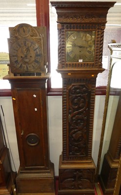 Lot 1191 - A relief carved oak longcase clock, having a...