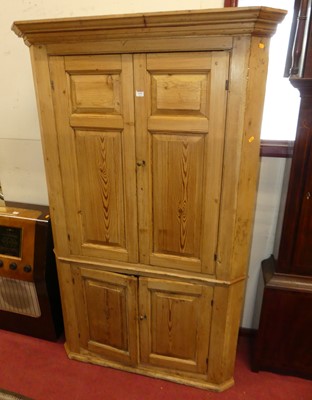 Lot 1193 - A 19th century pine four-door barrel back...