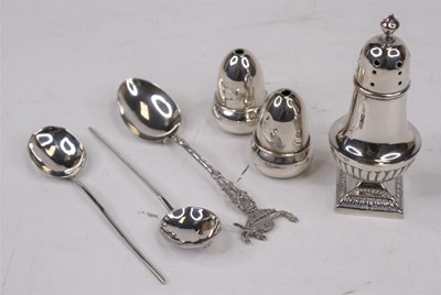 Lot 323 - A pair of George V silver peppers in the form...