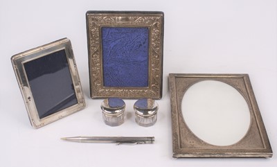 Lot 325 - A silver-clad picture frame, having an oval...
