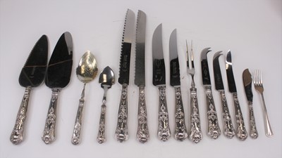 Lot 330 - A collection of silver handled flat ware in...