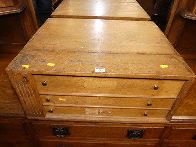 Lot 1227 - An early 20th century light oak three-drawer...