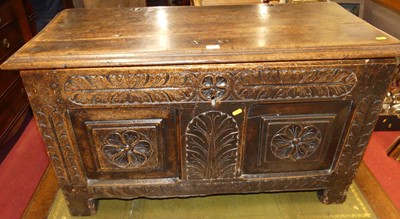 Lot 1240 - An antique floral relief carved walnut twin...
