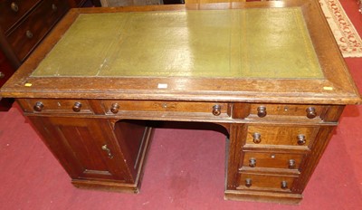 Lot 1241 - An early 20th century oak and gilt tooled...