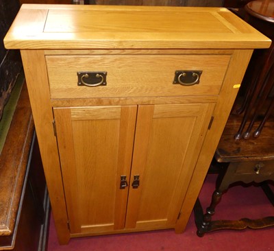 Lot 1243 - A contemporary light oak double door side...