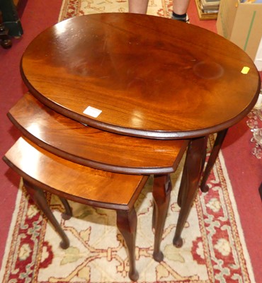 Lot 1244 - A mahogany and beech oval nest of three...