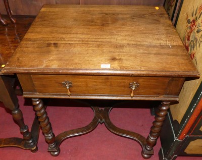 Lot 1247 - An early 20th century walnut single drawer...