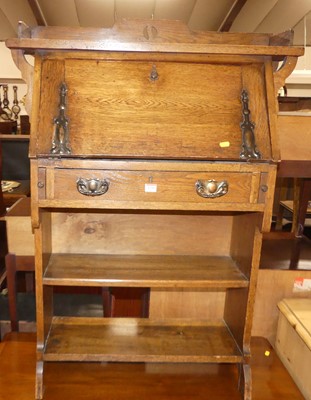 Lot 1250 - An Arts & Crafts oak student's bureau, having...