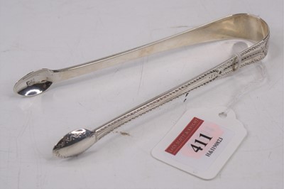 Lot 411 - A pair of 19th century silver sugar nips, with...
