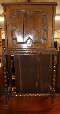 Lot 1256 - A made-up oak single door side cupboard raised...