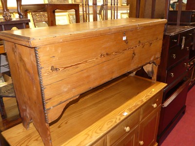 Lot 1267 - A close nailed stained pine long hinge top...