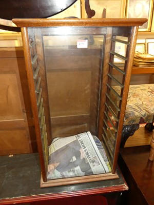 Lot 1271 - An early 20th century oak table top shop...