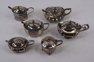 Lot 433 - An Edwardian ornate silver mustard, having a...