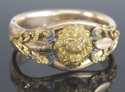 Lot 332 - An Edwardian rolled gold hinged bangle, of...
