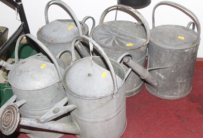 Lot 666 - Five vintage metal watering cans, each height...