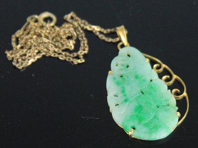 Lot 343 - A Chinese carved celadon and green jade...