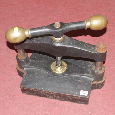 Lot 646 - A cast iron book press, width 41cm