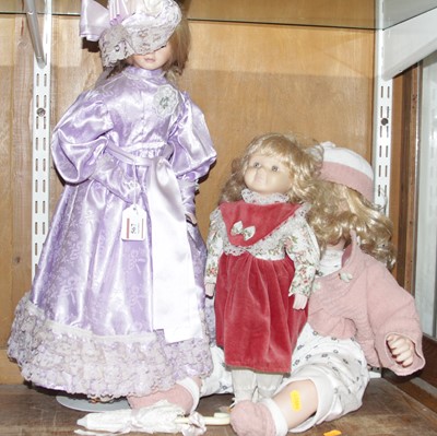 Lot 567 - Three 20th century bisque headed dolls, the...