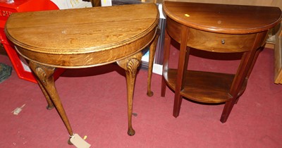 Lot 1300 - An early 20th century oak demi lune side table,...