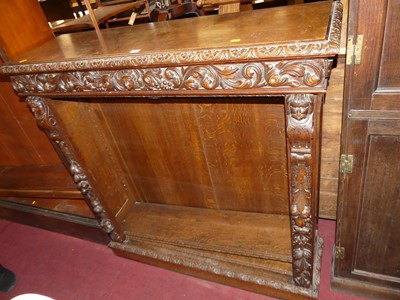 Lot 1315 - A circa 1900 heavily carved oak freestanding...