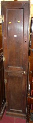 Lot 1316 - An oak freestanding converted two door gun...