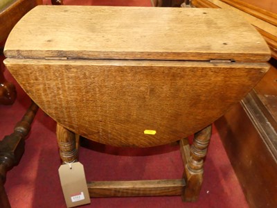 Lot 1312 - A contemporary joined oak drop flap low...
